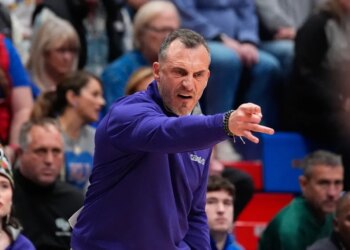 Green Bay head coach Doug Gottlieb motions to his players during an NCAA college basketball game against Kansas.