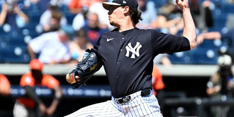 New York Yankees starting pitcher Max Fried (54) throwing a pitch during spring training.