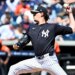 New York Yankees starting pitcher Max Fried (54) throwing a pitch during spring training.