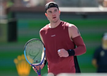 Jack Draper holding his tennis racket during the BNP Paribas Open.