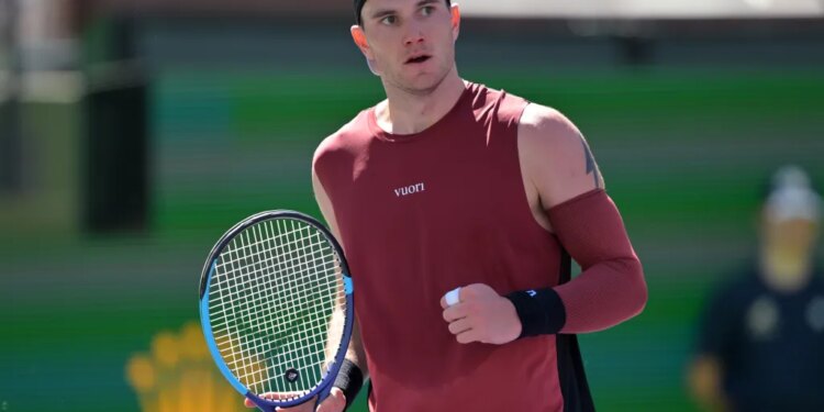 Jack Draper holding his tennis racket during the BNP Paribas Open.