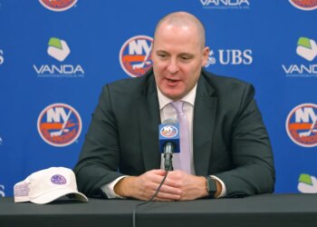 New York Islanders GM Mathieu Darche speaking at a press conference.