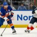 Ryan Pulock attempts a pass as Gustav Forsling defends during the Islanders 5-4 win over the Panthers on March 2, 2026.