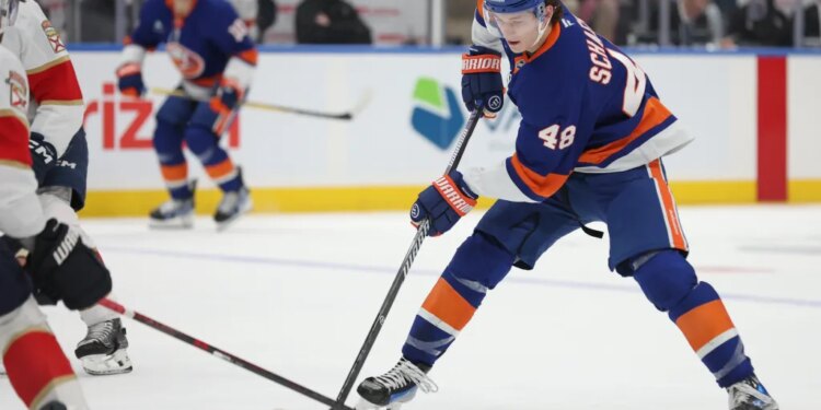 New York Islanders defenseman Matthew Schaefer (48) handles the puck during the first period of a game against the Florida Panthers.