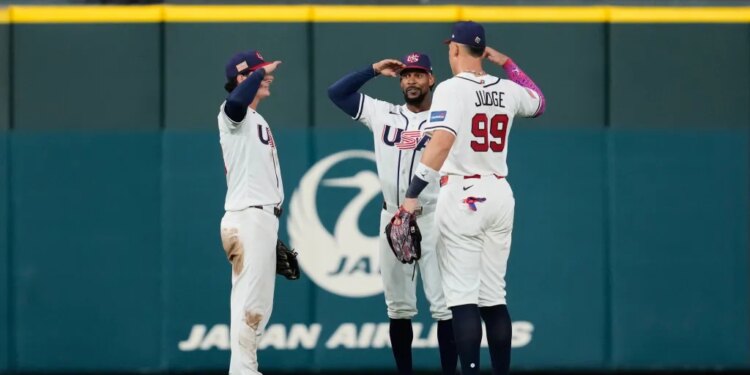 Baseball players Roman Anthony, Byron Buxton, and Aaron Judge on the field.