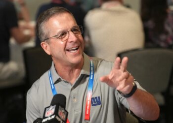 John Harbaugh, head coach of the New York Giants, speaking with reporters at the NFL annual meeting in Phoenix.