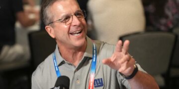 John Harbaugh, head coach of the New York Giants, speaking with reporters at the NFL annual meeting in Phoenix.