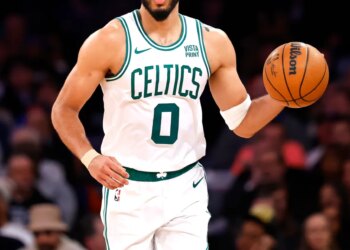 Boston Celtics forward Jayson Tatum (0) dribbles the ball against the New York Knicks during the second half at Madison Square Garden,  Saturday, February 24, 2024 in New York.