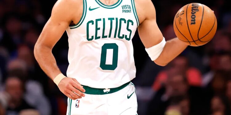 Boston Celtics forward Jayson Tatum (0) dribbles the ball against the New York Knicks during the second half at Madison Square Garden, Saturday, February 24, 2024 in New York.