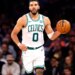 Boston Celtics forward Jayson Tatum (0) dribbles the ball against the New York Knicks during the second half at Madison Square Garden, Saturday, February 24, 2024 in New York.