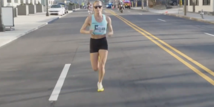 Jess McClain is in the lead with about a mile to go in the U.S. Half Marathon Championships on Sunday.