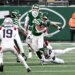 Jets running back Kene Nwangwu (34) breaks away from Patriots safety Dell Pettus (24).
