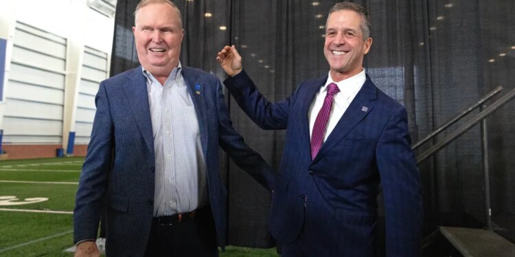 Giants owner John Mara (l.) and head coach John Harbaugh (r.) during Harbaugh's introduction on Jan. 20, 2026.