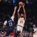 Mikal Bridges (25) of the Knicks shoots over the Wizards' Sharife Cooper (13) on March 22, 2026.