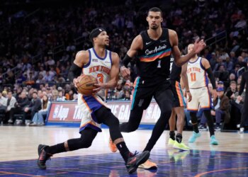 New York Knicks guard Josh Hart drives to the basket as San Antonio Spurs forward Victor Wembanyama gives chase.