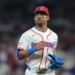 Dominican Republic center fielder Julio Rodriguez (44) returns to the dugout against the Netherlands during the sixth inning.