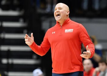 Belmont head coach Casey Alexander shouting instructions during a basketball game.