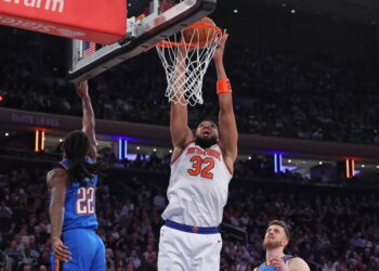 New York Knicks center Karl-Anthony Towns (32) dunks the ball during a game against the Oklahoma City Thunder.