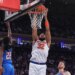 New York Knicks center Karl-Anthony Towns (32) dunks the ball during a game against the Oklahoma City Thunder.