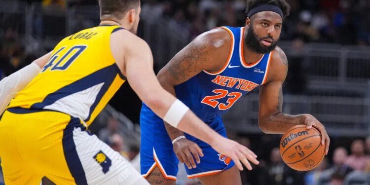 Mitchell Robinson, who grabbed 22 rebounds, drives on Ivica Zubac during the Knicks' 101-92 win over the Pacers on March 13, 2026 in Indianapolis.