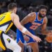 Mitchell Robinson, who grabbed 22 rebounds, drives on Ivica Zubac during the Knicks' 101-92 win over the Pacers on March 13, 2026 in Indianapolis.