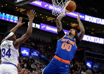 Jordan Clarkson, who scored 27 points off the bench, goes up for a layup as Oscar Tshiebwe  defends during the Knicks' 134-117 win overt the Jazz in Salt Lake City on March 11, 2026.