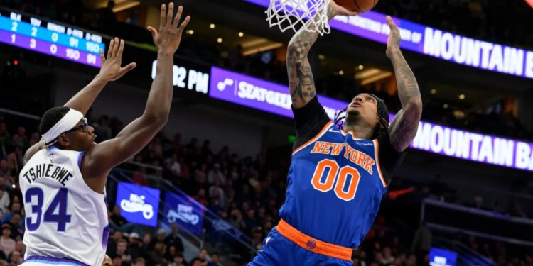 Jordan Clarkson, who scored 27 points off the bench, goes up for a layup as Oscar Tshiebwe defends during the Knicks' 134-117 win overt the Jazz in Salt Lake City on March 11, 2026.