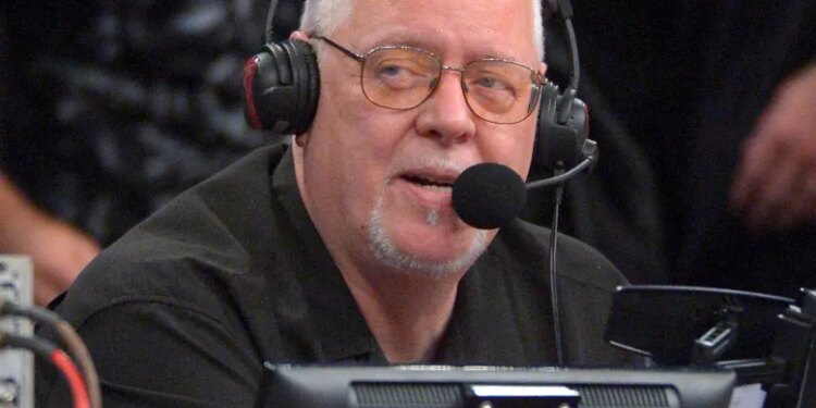 Los Angeles Lakers announcer Lawrence Tanter wearing headphones and a microphone.