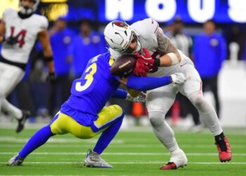 Los Angeles Rams safety Kam Curl breaks up a pass to Arizona Cardinals tight end Trey McBride.
