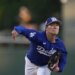 Dodgers pitcher Yoshinobu Yamamoto throws a pitch during a spring training game.