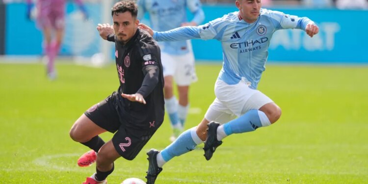 Inter Miami's Gonzalo Luján, left, and New York City FC's Nicolás Fernández compete for the ball during the first half of an MLS soccer game at Yankee Stadium in New York, Sunday, March 22, 2026.