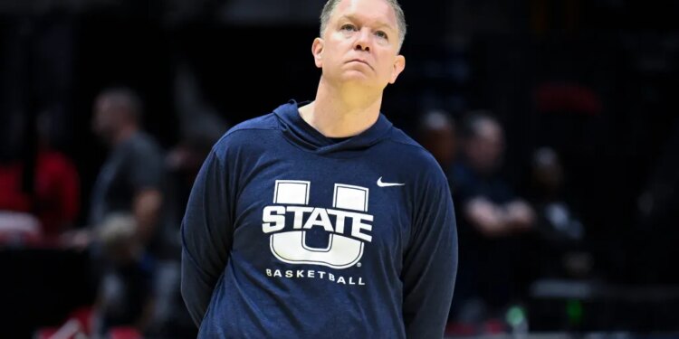 Utah State Aggies head coach Jerrod Calhoun watching practice before the first round of the NCAA Tournament.