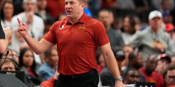 Iowa State head coach T.J. Otzelberger on the sidelines during a college basketball game.