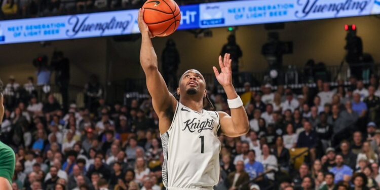 UCF Knights guard Themus Fulks (1) goes to the basket.