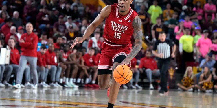 Texas Tech forward JT Toppin drives against Arizona State during the first half of an NCAA college basketball game, Tuesday, Feb. 17, 2026, in Tempe, Ariz. (AP Photo/Rick Scuteri)