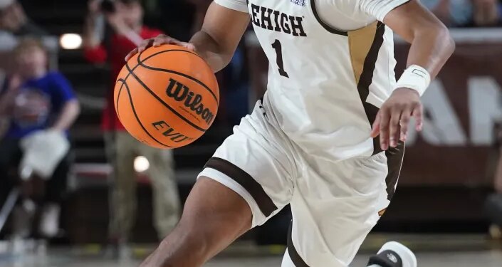 Lehigh Mountain Hawks guard Nasir Whitlock dribbles the ball during a game.
