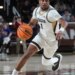 Lehigh Mountain Hawks guard Nasir Whitlock dribbles the ball during a game.