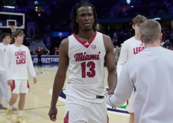 Antwone Woolfolk, a Miami forward, on the basketball court after a game.
