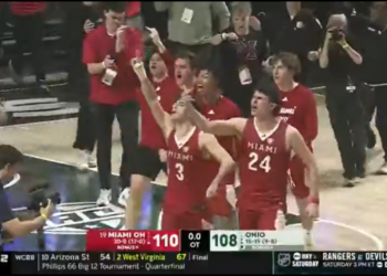 Miami Ohio players throw the bird to Ohio Bobcat fans after beating them in overtime to cap off an undefeated regular season.