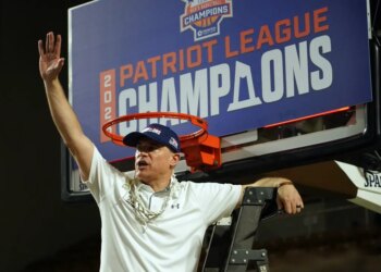 Lehigh Mountain Hawks head coach Brett Reed celebrates after winning the Patriot League Championship.