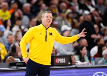 Michigan Wolverines head coach Dusty May gestures during a game.