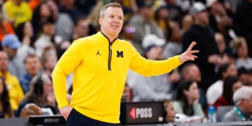 Michigan Wolverines head coach Dusty May gestures during a game.