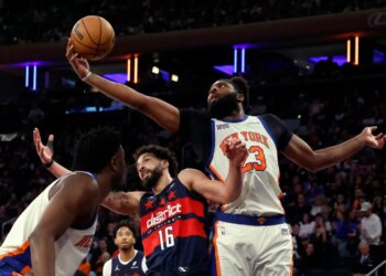 03/22/26 New York Knicks vs Washington Wizards at Madison Square Garden: Center Mitchell Robinson #23 of the New York Knicks pulls a rebound away from forward Anthony Gill #16 of the Washington Wizards