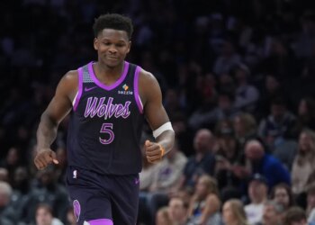 Minnesota Timberwolves guard Anthony Edwards reacting after missing a shot.
