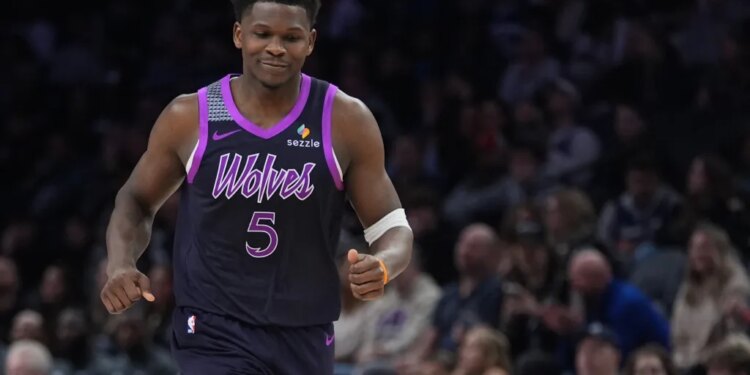 Minnesota Timberwolves guard Anthony Edwards reacting after missing a shot.