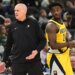 Indiana Pacers coach Rick Carlisle reacts with player Kobe Brown during a basketball game against the Milwaukee Bucks.