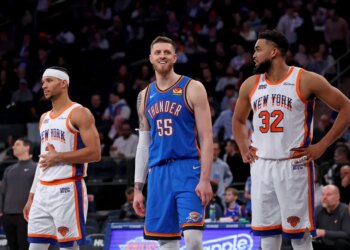 Oklahoma City Thunder center Isaiah Hartenstein #55 is all smiles between New York Knicks guard Josh Hart #3 and New York Knicks center Karl-Anthony Towns #32 during the third quarter at Madison Square Garden.
