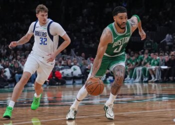 Boston Celtics forward Jayson Tatum (0) drives to the basket.