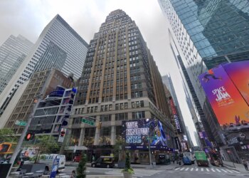 Street view of Times Square with billboards, including "We Know NYC" and "Space Jam: A New Legacy."