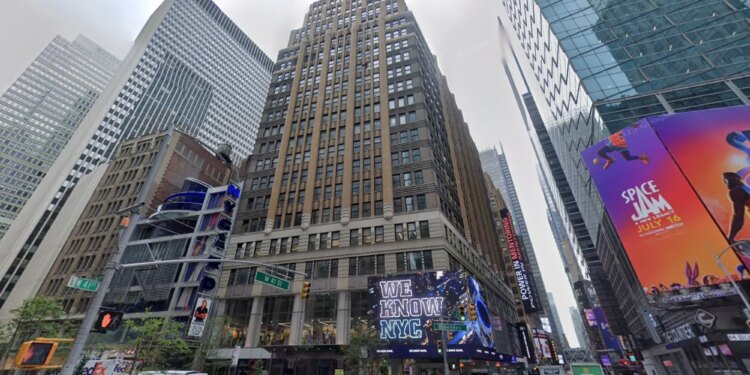 Street view of Times Square with billboards, including "We Know NYC" and "Space Jam: A New Legacy."
